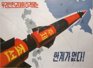 North Korean propaganda poster showing a missile flying over Japan to the United States on a global map.