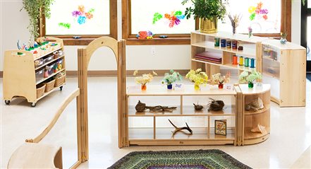 Preschool classroom with open shelving to separate activity areas and ease supervision.