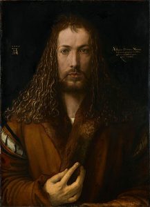 Front-facing portrait of man with long hair